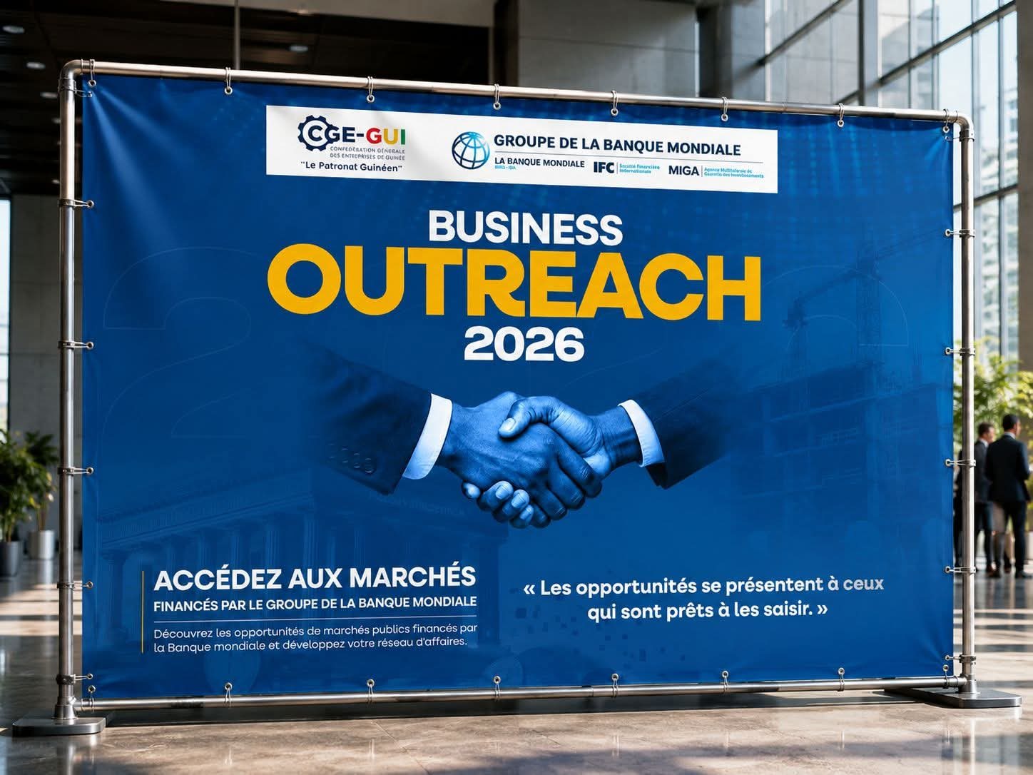 Realistic large-format banner mockup showing how the Business Outreach 2026 campaign artwork would appear at a professional event venue.